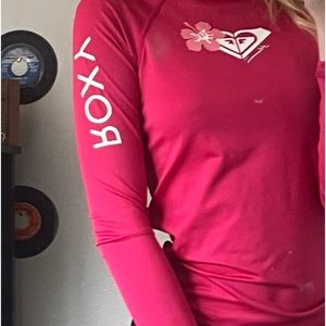 Pink rash guard for surfing, body boarding, etc.